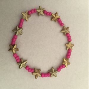 Hand crafted Neon pink bracelet with gold stars